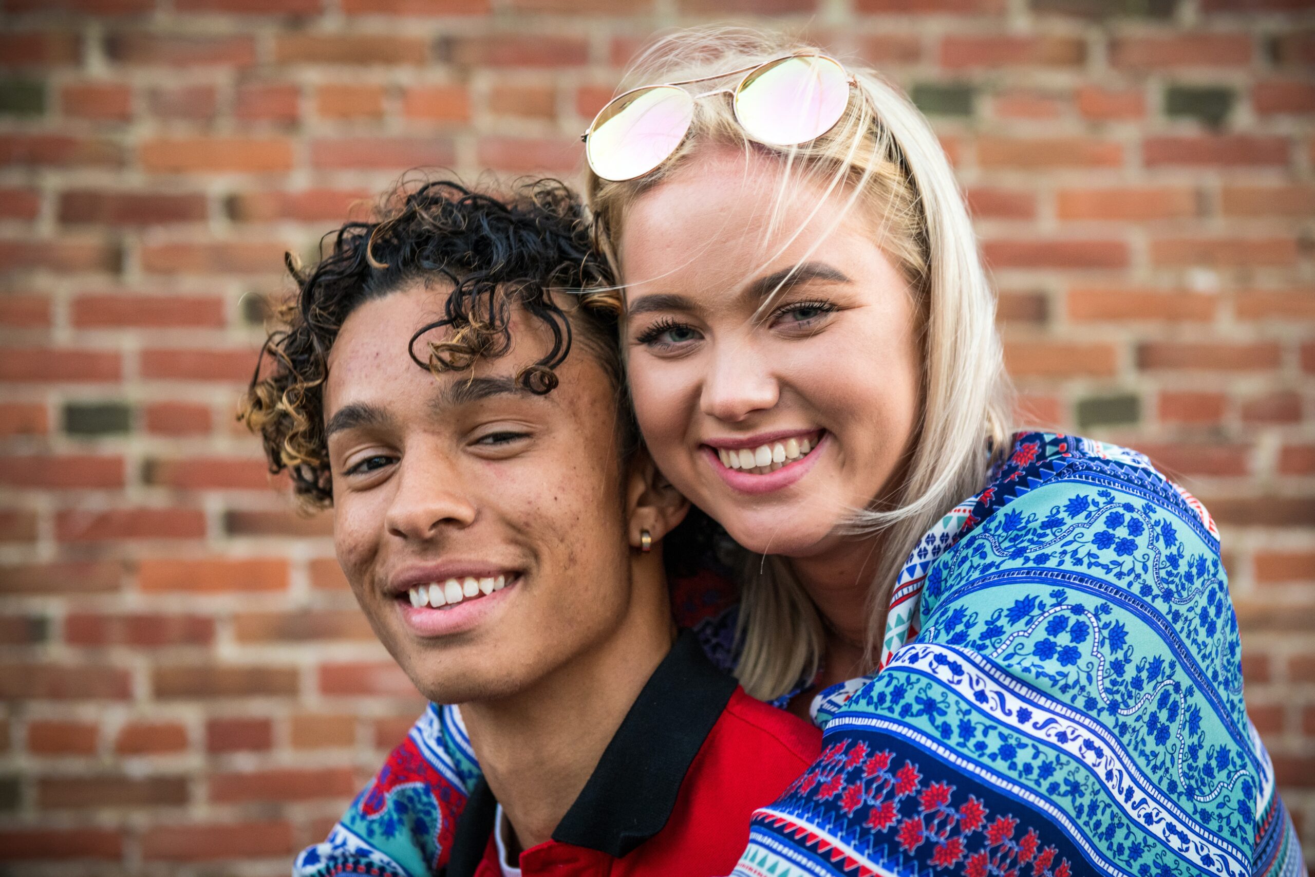 young couple hugging and smiling